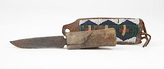 A Plains Indian knife & beaded leather sheath