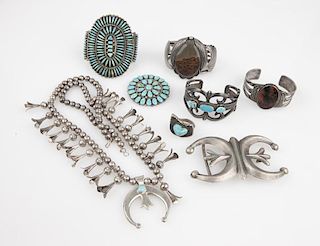 A group of Native American jewelry