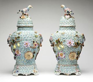 A pair of Dresden porcelain relief-decorated urns
