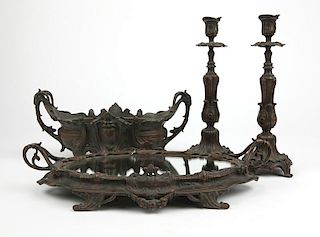 A four-piece spelter console table set