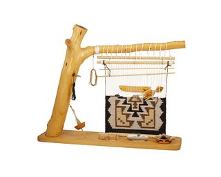 A loom with a Navajo Two Grey Hills weaving sample