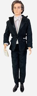 A Silkstone Ken from the BFMC named Tailored Tuxedo & he is a Gold Label Ken with no more than 4,000 dolls worldwide. He is wearing a black tuxedo wit