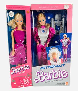 (2) pink boxed Barbies. Astronaut Barbie in hot pink and silver spacesuit. Her box has slight scuffing on 3 sides. Barbie Mode, a 1987 France Barbie w
