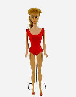 Beautiful #5 Barbie with her blond ponytail hair, red bathing suit & reds shoes. Her nail polish is still on, however, her toenails looks rubbed off. 
