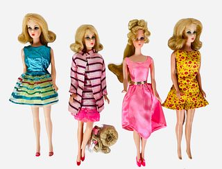 (4) Barbies Including (1) TNT blond flip wearing Twinkle Togs with dress only and shoes. Barbie's legs click 3 times & her face is lit up w/ beautiful