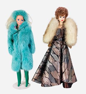 (2) Beautiful Barbie dolls wearing real fur coats including (1) turquoise long fur with matching hat. The modeling Barbies are playline dolls. In box 