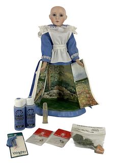 15" porcelain doll with surprise skirt and includes items within.