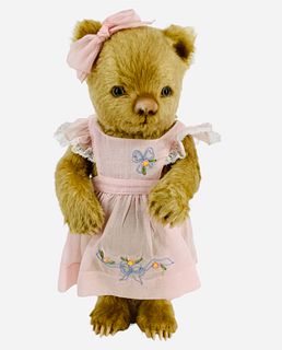 R. John Wright "Flora" from the Toddler Bears Collection. 11" mohair bear jointed at the neck, shoulders and hips, glass eyes, molded felt nose and pa