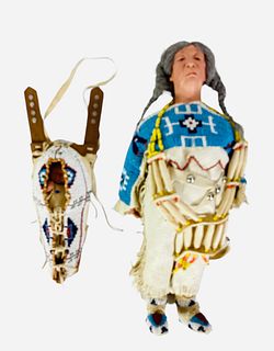 (2) Native American dolls by NIADA artist June Goodnow. Includes 15" elderly woman with mohair wig, molded and painted facial features, on cloth body;
