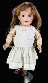 S.F.B.J. 236 bisque socket head character. 15" doll with human hair wig, glass sleep eyes with eyelashes, open/closed mouth with 2 molded upper teeth,