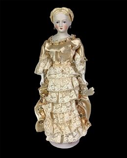 Parian-type lady by Emma Clear. 15 1/4" shoulder head doll with molded and painted hair and facial features, fancy blonde hairstyle with gold luster a