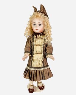 Reproduction Long Face Jumeau. 17" doll with mohair wig, stationary glass eyes, closed mouth, on jointed Seeley body. Doll is marked "D.A.G. Specialty