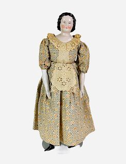 China shoulder head lady with Unusual Hairstyle. 17" doll with molded and painted hair and facial features, on stitch-jointed cloth body with china lo