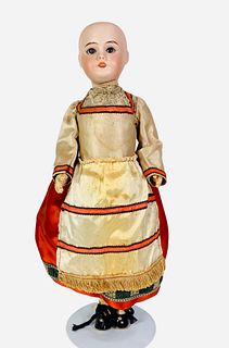 S.F.B.J. 60 bisque socket head girl. 14" doll with glass set eyes, open mouth with molded teeth, on crude five-piece composition body. Doll is dressed