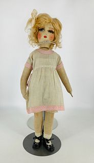 All cloth boudoir type girl. 25" mask face with molded and painted facial features, mohair wig and eyelashes, on cloth body with stitch jointed arms a