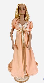 16" Tonner doll "Glamour Sydney" dressed in peach night gown and robe with yellow shoes. No box.