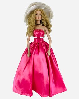 16" Tonner Tyler Wenworth Collection Ready To Wear doll dressed in pink satin gown with white feather hat. In good condition. No box.