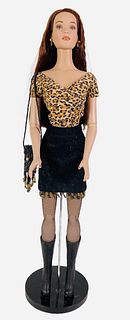16" Tonner doll dressed in (unknown) leopard top and black skirt and boots. In great condition. Includes a purse. No box.