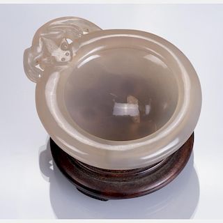 A Chinese Carved Agate Washer on a Carved Hardwood Stand.