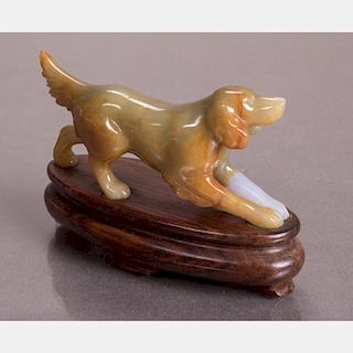 A Carved Agate Dog Figure on a Carved Hardwood Stand.