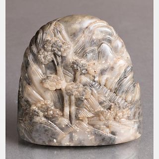 A Chinese Carved Grey Soapstone Boulder Depicting a Mountain Landscape.