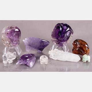 A Group of Chinese Carved Amethyst, Amber and Rock Crystal Animal Forms.
