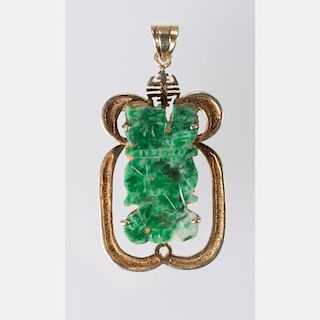 A 14kt. Yellow Gold, Green Jade and Diamond Melee Pendant.