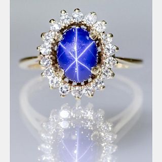 A 14kt. Yellow Gold, Cabochon Cut Linde Star Sapphire and Diamond Ring,