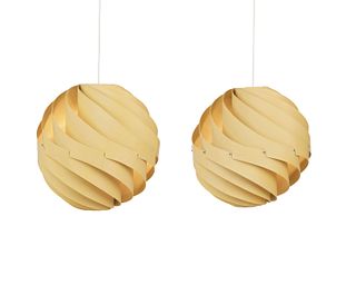 A pair of modern spiral pendant lights