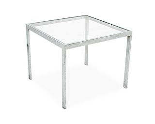 A Milo Baughman-style chrome and glass end table