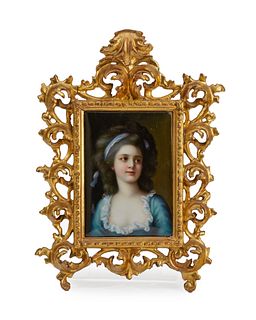 A framed porcelain portrait plaque