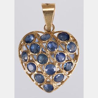 An 18kt. Yellow Gold and Sapphire Heart Form Pendant,