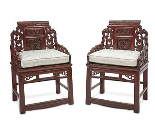 A pair of Chinese carved wood armchairs