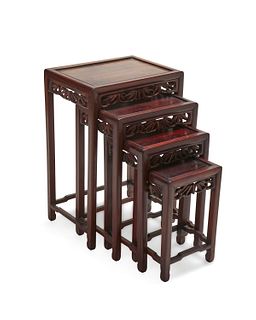 A set of Chinese carved wood nesting tables