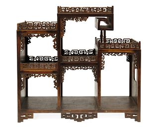 A Chinese carved hardwood table-top stand