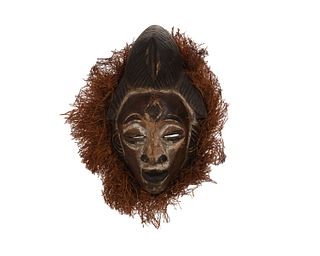 A Gabonese carved wood ancestor mask