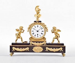 An English gilt and patinated bronze mantel clock signed Baetens London