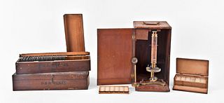A Beck monocular microscope and two boxes of lantern slides illustrating valves