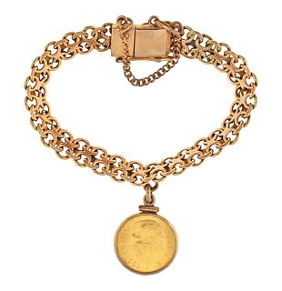 A mid 20th century 14 karat gold bracelet with Mexican 5 peso charm