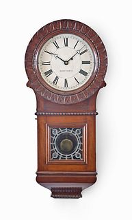 An Unusal Boston Clock Co. Hanging Clock with Carved Bezel and Art Glass Tablet