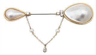 Tambetti 14 Karat Gold Brooch, having large pearl top over three diamonds, over smaller pearl under one diamond, height 3 3/4 inches.