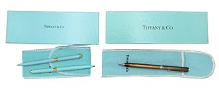 Three Tiffany & Company Pens, to include two Tiffany blue, along with one sterling silver, in boxes and bags.