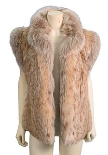 Natural Lynx Vest, having blush dyed fox collar and arm hole trim, width 20 inches, original purchase price $3,500, length 20 inches.