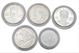 Five Piece Lot, to include two RFK silver dollars, one uncirculated, one proof; one JFK 1992 1/2 dollar with special finish; a silver World War II unc