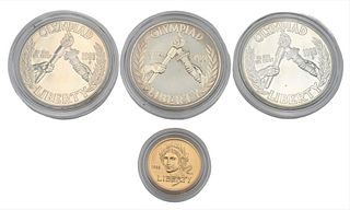 Four Piece 1988 Olympic Set, to include two uncirculated dollars, one proof dollar, along with one uncirculated five dollar gold.