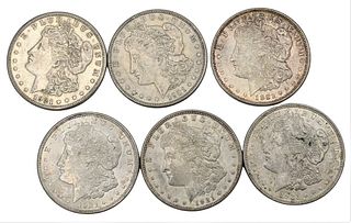 Six Morgan Silver Dollars, to include fine and AU.