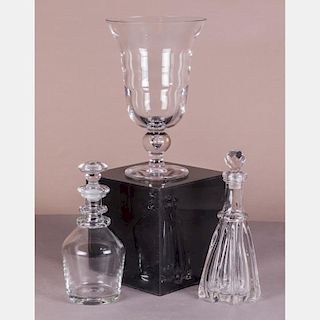A Collection of Blown Glass Decanters and Footed Vase, 20th Century.