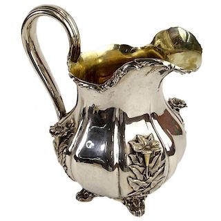 Early 19th Century German 875 Silver Footed Pitcher With Relief of Flowers.