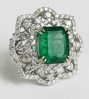 GIA Certified 7.08 Carat Octagonal Step Cut Emerald, approx. 3.72 Carat Round Cut Diamond and 18 Karat White Gold Ring.
