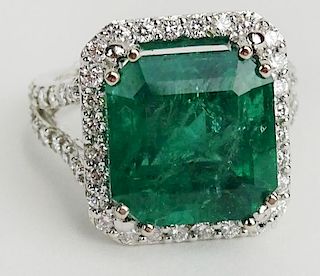 GIA Certified 9.71 Carat Octagonal Step Cut Emerald, approx. 1.21 Carat Round Cut Diamond and 18 Karat White Gold Ring.